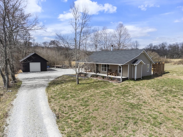 ranch-style house with a garage, gravel driveway, a porch, and a front yard