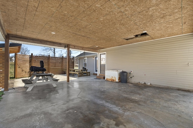 view of patio / terrace featuring entry steps and fence