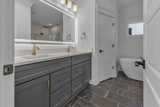 bathroom with marble finish floor, a sink, a shower stall, and double vanity