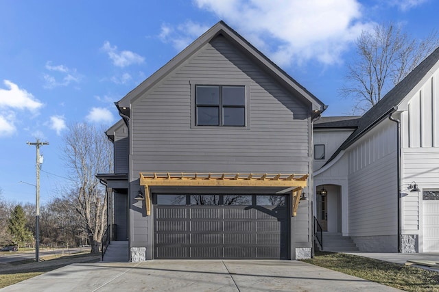 view of front facade featuring driveway and an attached garage