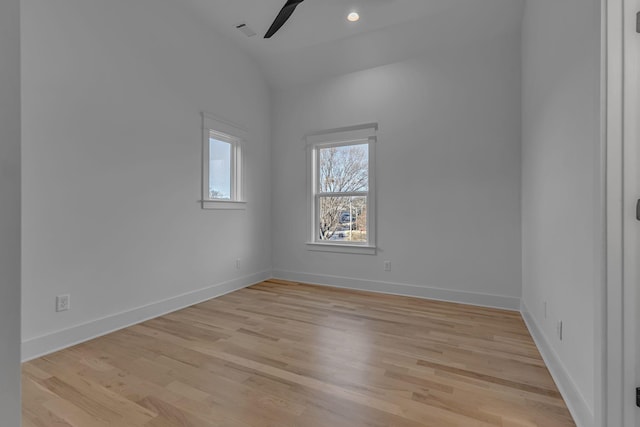 empty room with light wood-style flooring, visible vents, baseboards, and ceiling fan