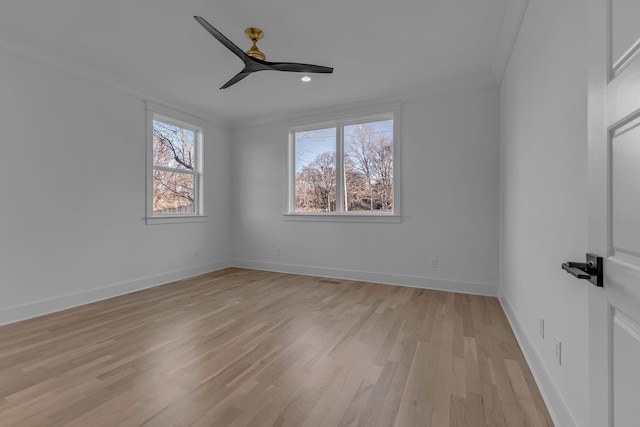 unfurnished bedroom featuring a ceiling fan, crown molding, light wood-style flooring, and baseboards