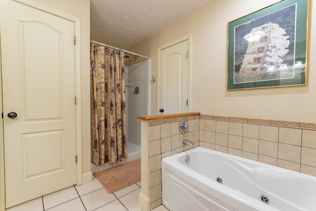 bathroom with a bath, a shower with shower curtain, a textured ceiling, and tile patterned floors