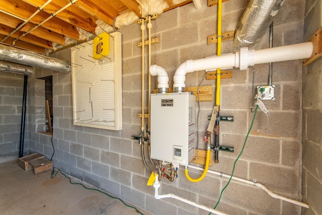 utility room with tankless water heater