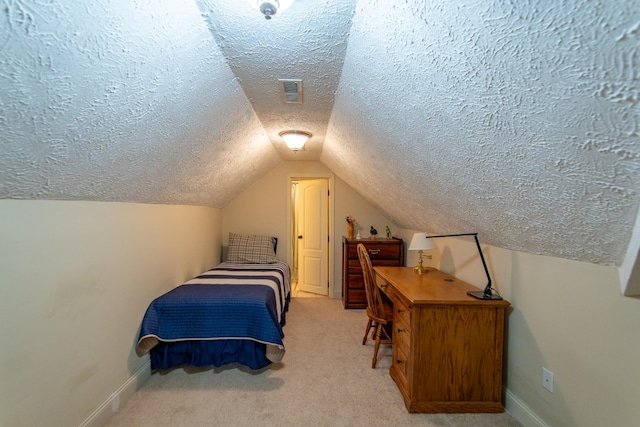 bedroom with a textured ceiling, vaulted ceiling, carpet flooring, and visible vents