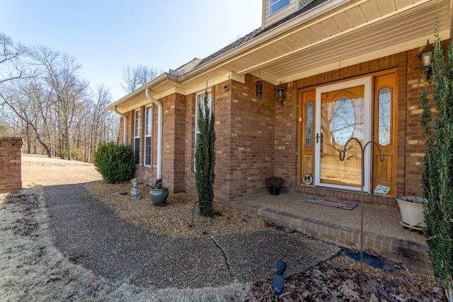 entrance to property with brick siding