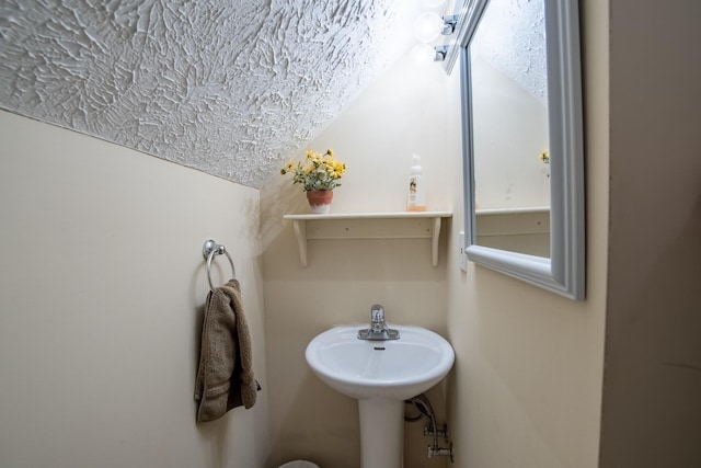 bathroom with vaulted ceiling