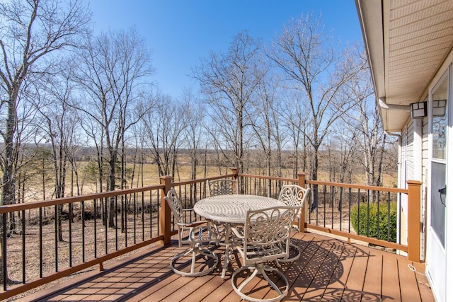 deck with outdoor dining area