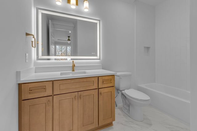 bathroom featuring a ceiling fan, marble finish floor, vanity, and toilet