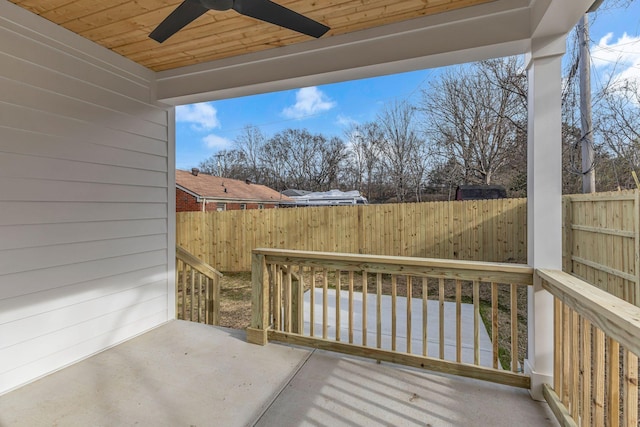 wooden deck featuring a patio, a fenced backyard, and a ceiling fan