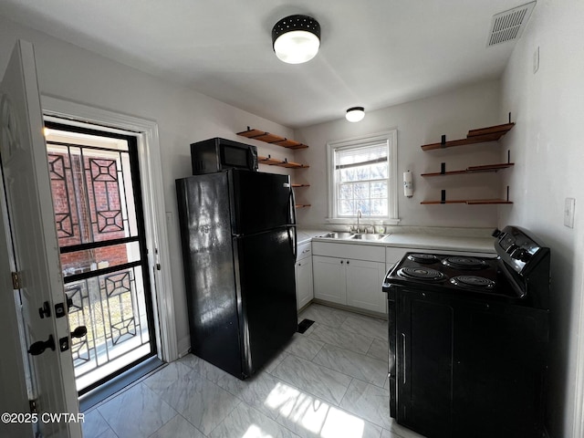 kitchen featuring open shelves, a sink, visible vents, marble finish floor, and black appliances