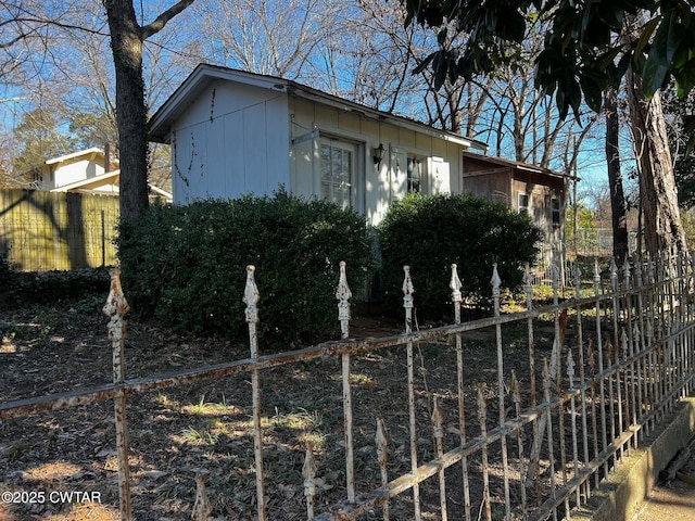 view of home's exterior with fence