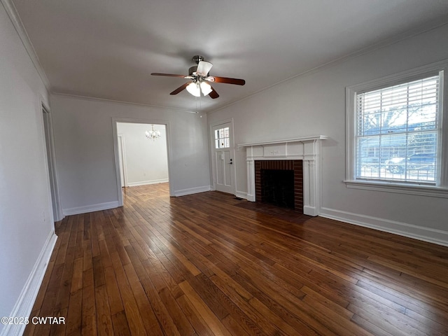 unfurnished living room featuring a healthy amount of sunlight, hardwood / wood-style flooring, a fireplace, and ornamental molding