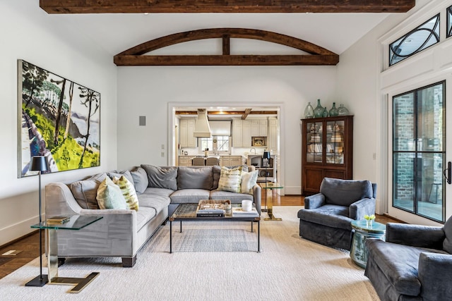 living room featuring plenty of natural light, baseboards, and wood finished floors