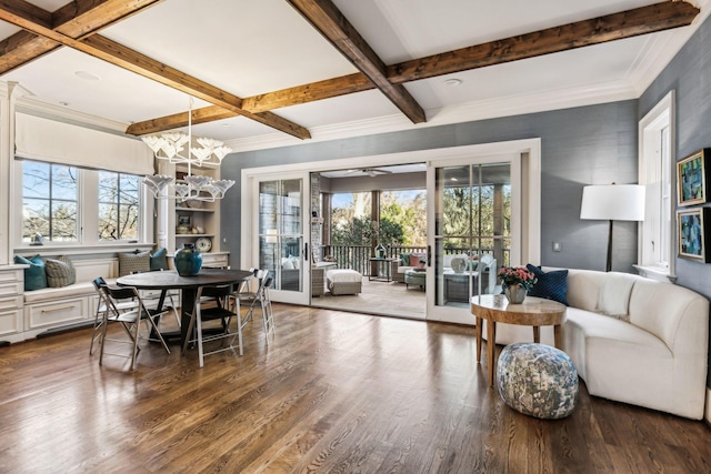 dining area featuring an inviting chandelier, beam ceiling, coffered ceiling, and wood finished floors