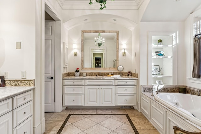 full bathroom featuring a garden tub, ornamental molding, and vanity