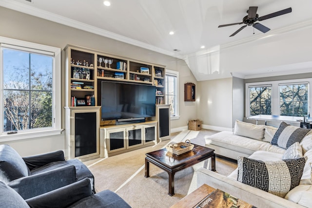 living room with carpet floors, plenty of natural light, ornamental molding, and baseboards