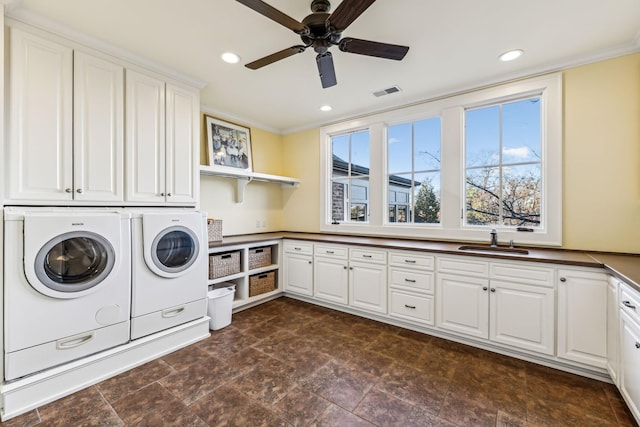 laundry room with cabinet space, visible vents, independent washer and dryer, a sink, and recessed lighting