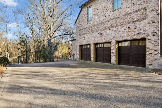 garage with concrete driveway