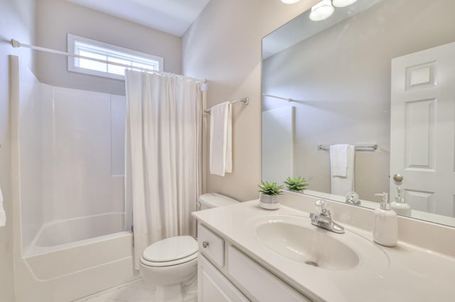 bathroom with vanity, toilet, and shower / bath combo with shower curtain