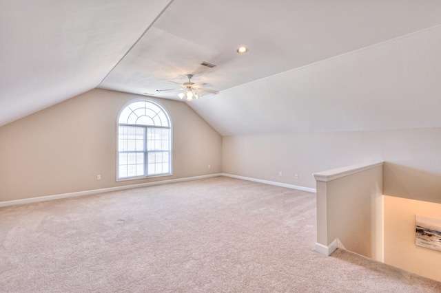 bonus room with visible vents, baseboards, carpet flooring, lofted ceiling, and ceiling fan