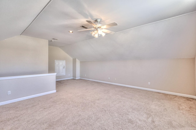 additional living space featuring baseboards and carpet