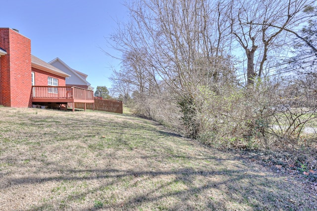 view of yard featuring a wooden deck