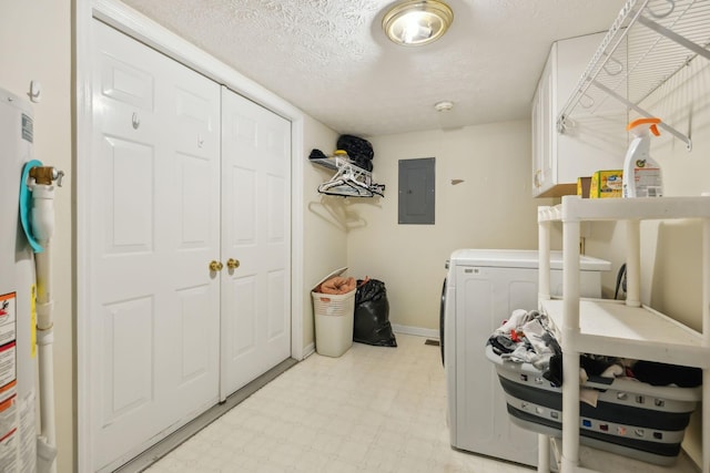 clothes washing area featuring light floors, washing machine and clothes dryer, cabinet space, a textured ceiling, and electric panel