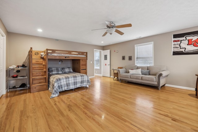 bedroom featuring light wood-style floors and baseboards