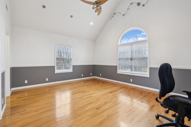 office area with high vaulted ceiling, ceiling fan, baseboards, and wood finished floors