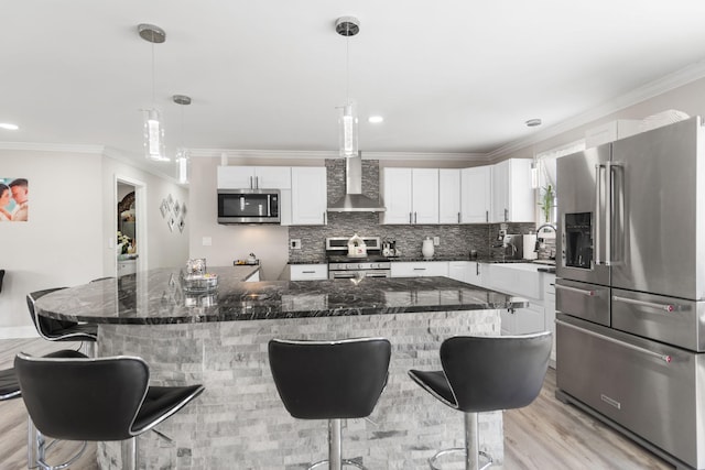 kitchen featuring crown molding, stainless steel appliances, white cabinets, and decorative backsplash