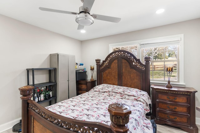 bedroom with ceiling fan, recessed lighting, wood finished floors, and baseboards