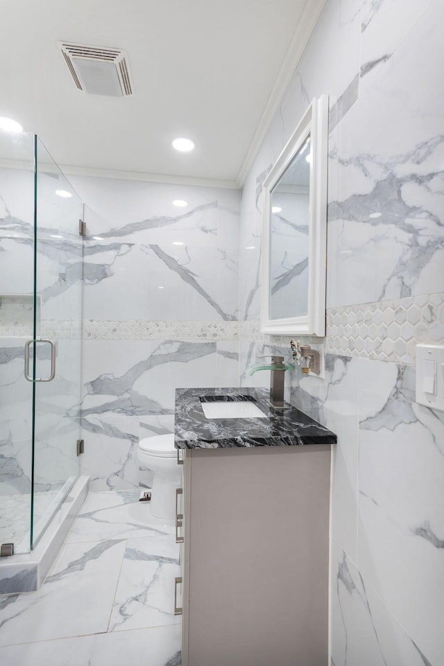 bathroom with vanity, visible vents, tile walls, marble finish floor, and a marble finish shower