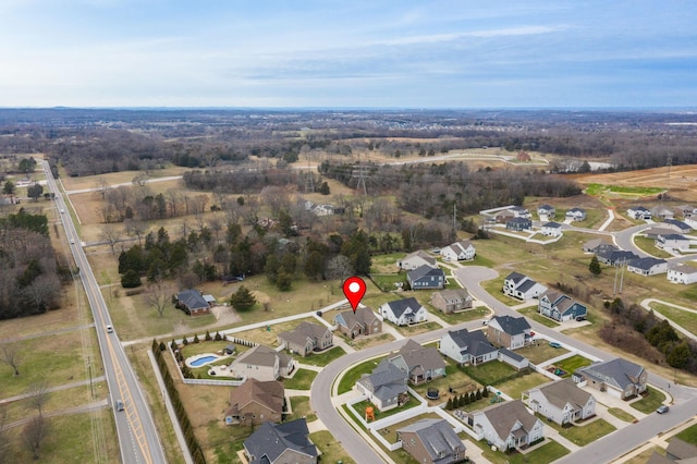 birds eye view of property with a residential view