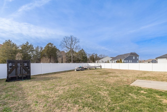 view of yard with a fenced backyard