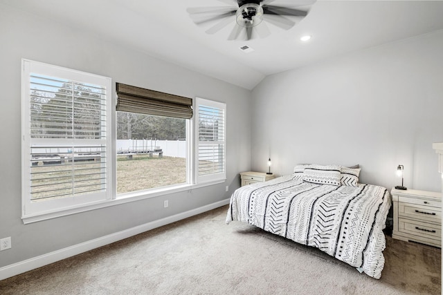 carpeted bedroom featuring visible vents, baseboards, a ceiling fan, vaulted ceiling, and recessed lighting