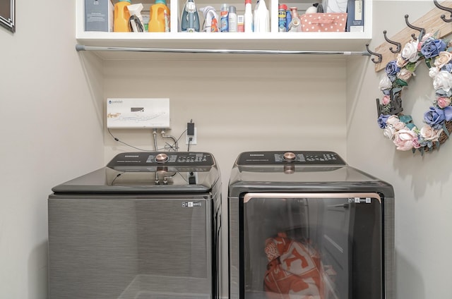 washroom with washer and dryer and laundry area