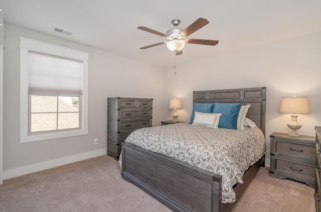 bedroom with light carpet, baseboards, visible vents, and a ceiling fan