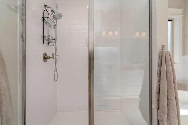 full bath featuring a shower stall