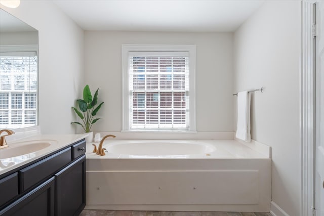 full bathroom featuring vanity and a bath