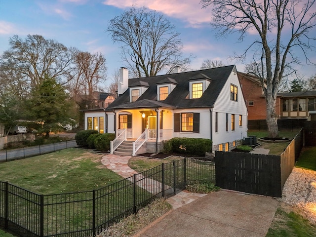 view of front facade featuring a fenced front yard, a chimney, covered porch, a lawn, and a gate