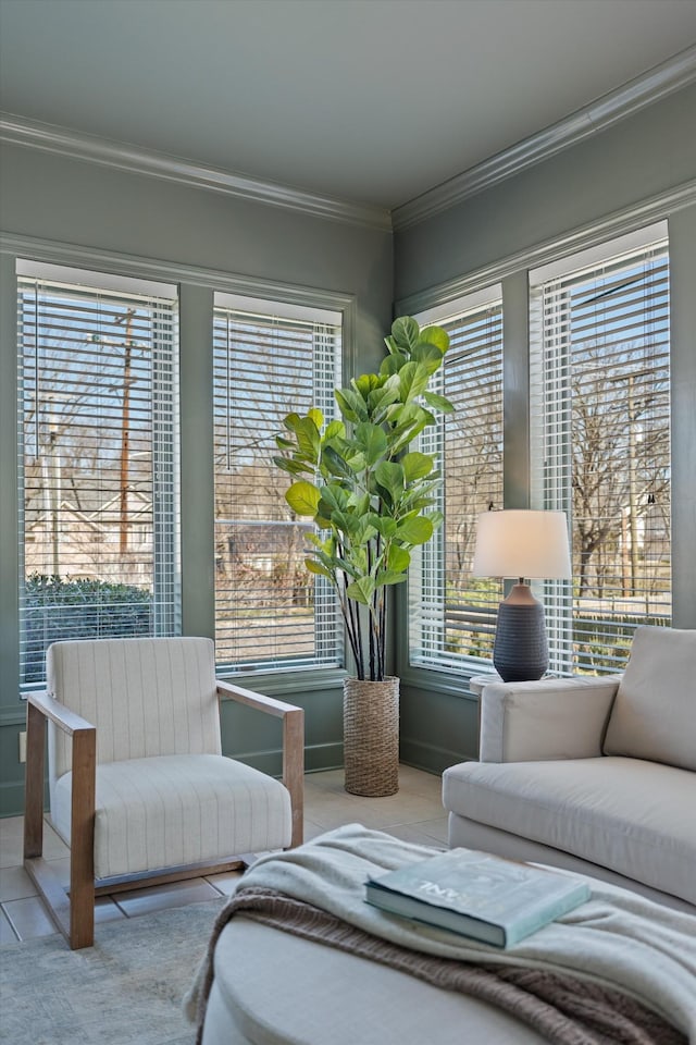 living area featuring ornamental molding and tile patterned flooring