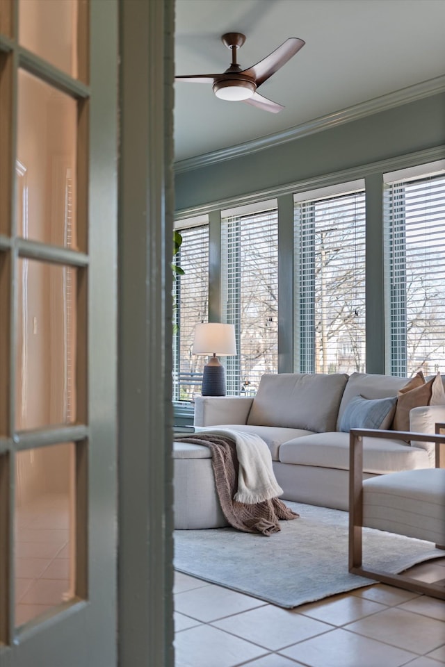 sunroom featuring ceiling fan