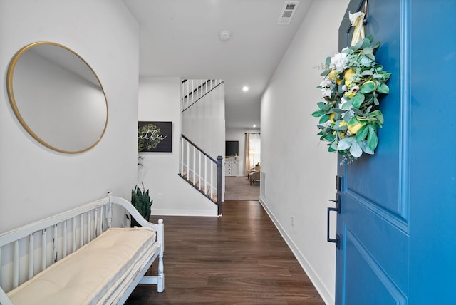 entryway featuring recessed lighting, visible vents, wood finished floors, baseboards, and stairs