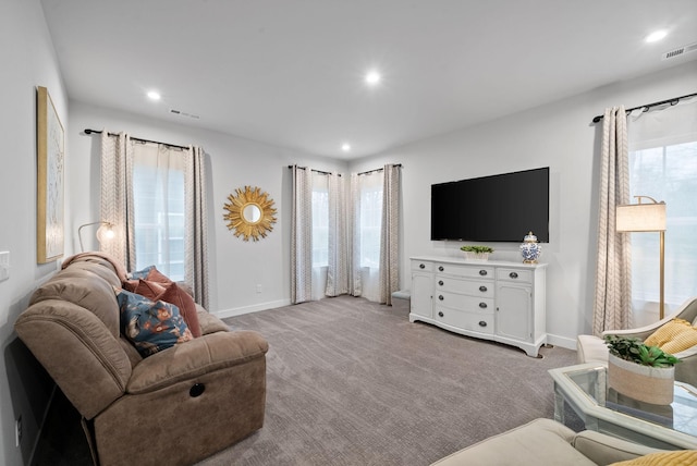 living room featuring carpet floors, recessed lighting, visible vents, and baseboards