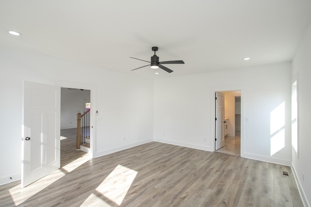 unfurnished bedroom with baseboards, light wood-style flooring, and recessed lighting