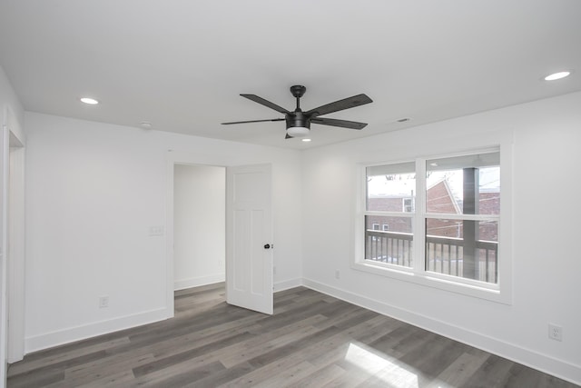 empty room featuring ceiling fan, baseboards, wood finished floors, and recessed lighting