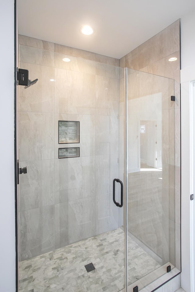 full bath featuring a stall shower