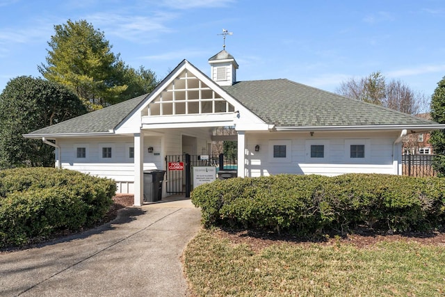 view of property featuring driveway and an attached carport