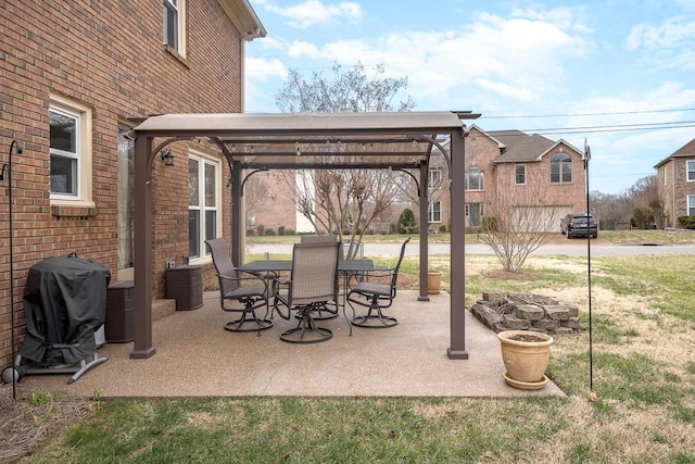 view of patio / terrace featuring outdoor dining space, a pergola, and area for grilling